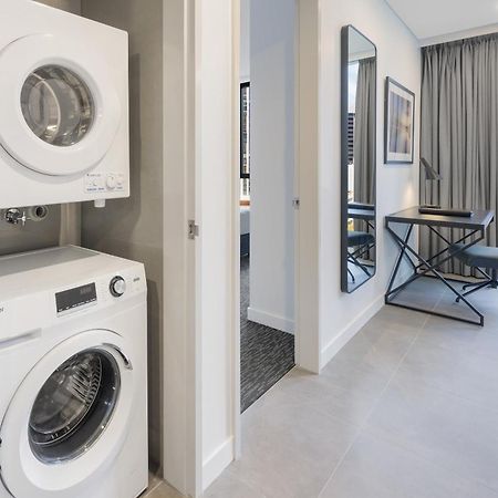Meriton Suites Melbourne Exterior foto Laundry facilities in a typical apartment