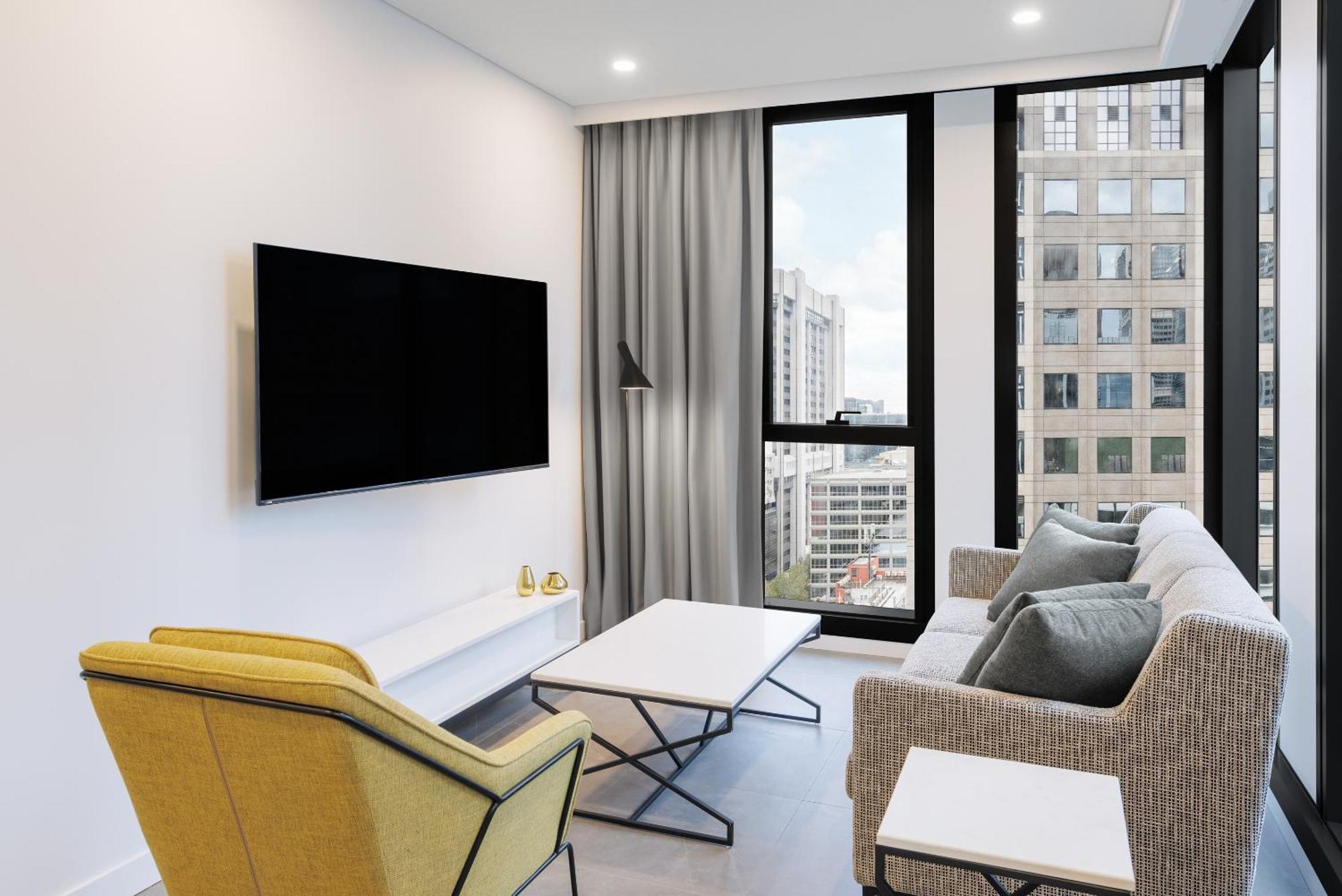 Meriton Suites Melbourne Exterior foto A living room